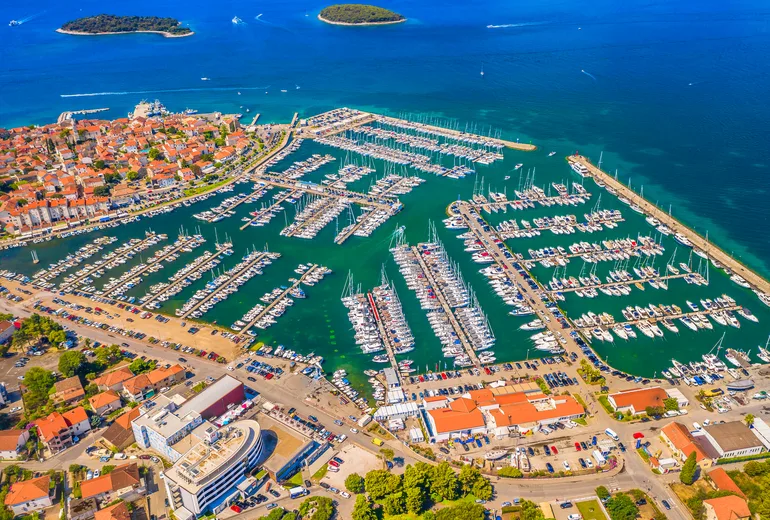 Aerial of Biograd na Moru marina packed with yachts, islands offshore