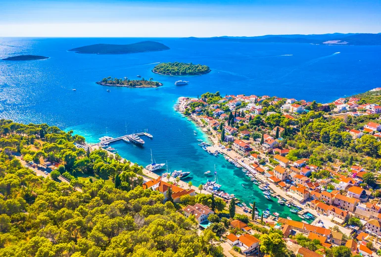 Aerial of Maslinica village on Solta with offshore islets and a small marina