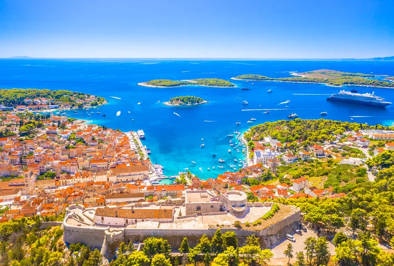 Hvar town, the Spanish fortress walls and the Pakleni islands seen from above
