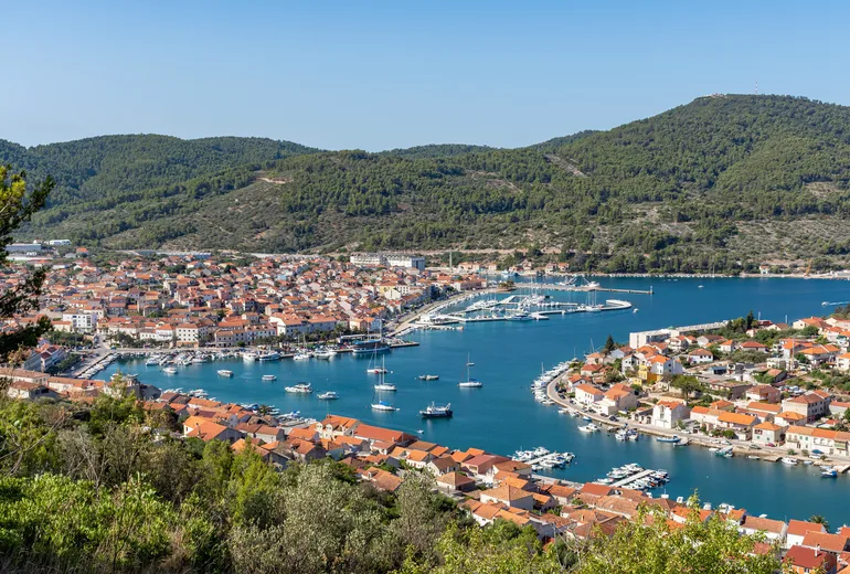 Panorama of Vela Luka bay town on Korčula with moored boats