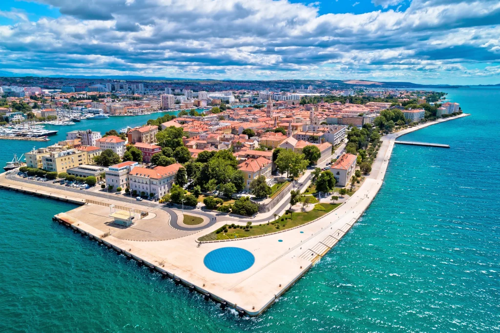 Aerial of Zadar old town peninsula with Greeting to the Sun circle