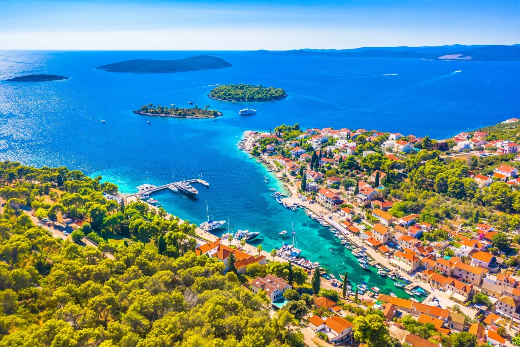 Aerial of Maslinica village on Solta with offshore islets and small marina