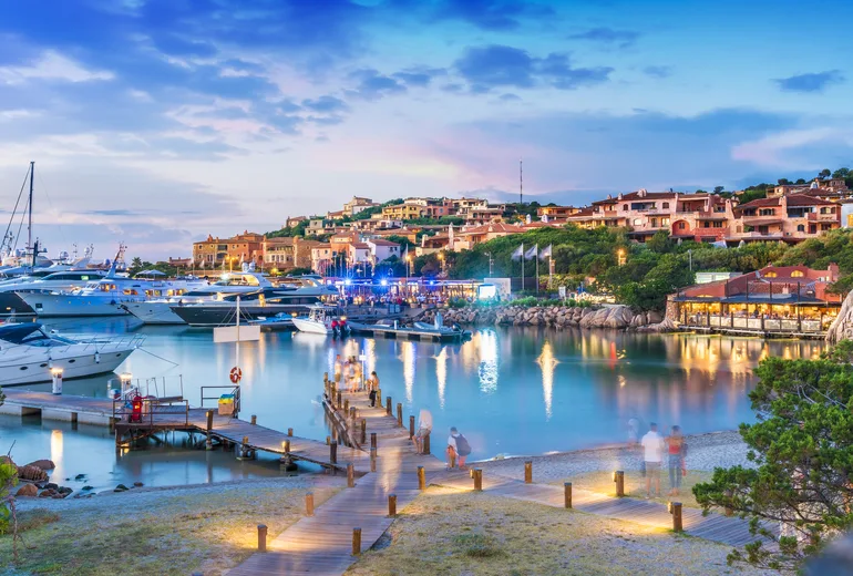 Superyachts at an exclusive Mediterranean marina at dusk